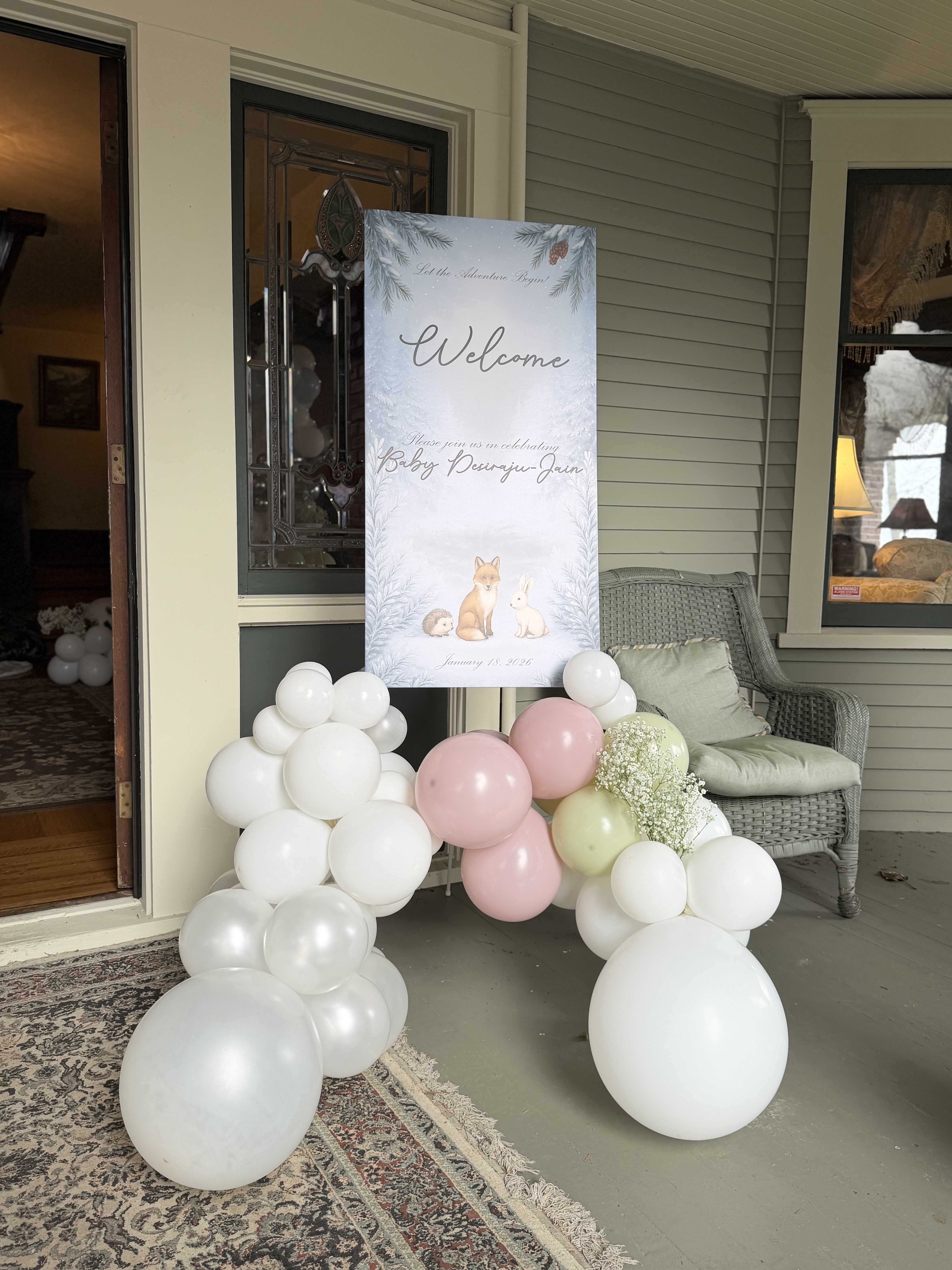 Graduation welcome sign with black gold balloon garland